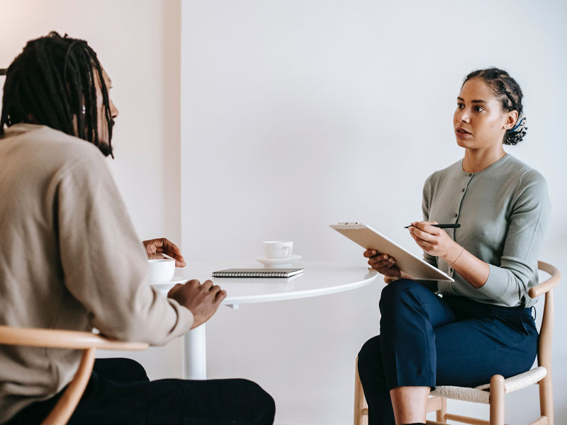 a therapist talking to a client during a therapy session